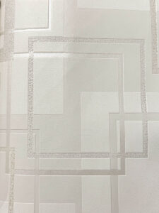 幾何学模様の組み合わされた壁紙。溝の奥行きがあったり、光沢や風合いが異なる模様の組み合わせ。